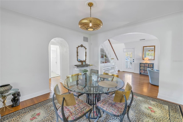 dining space featuring hardwood / wood-style floors