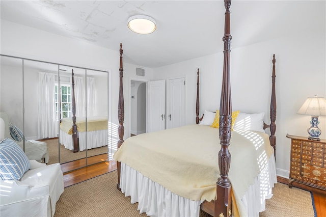 bedroom featuring a closet and light hardwood / wood-style flooring