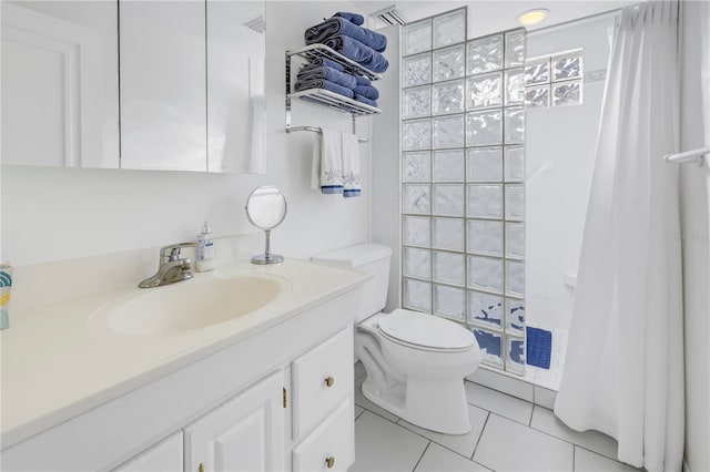 bathroom featuring vanity, tile patterned flooring, a shower with curtain, and toilet