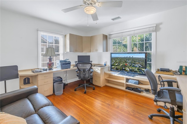 office area with ceiling fan and light wood-type flooring