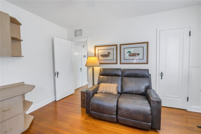 sitting room featuring light wood-type flooring