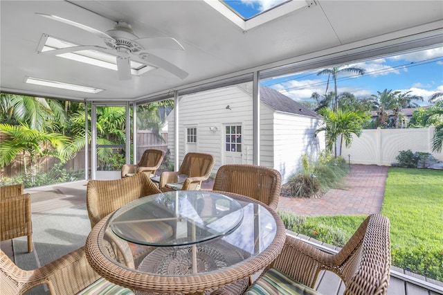 sunroom featuring ceiling fan