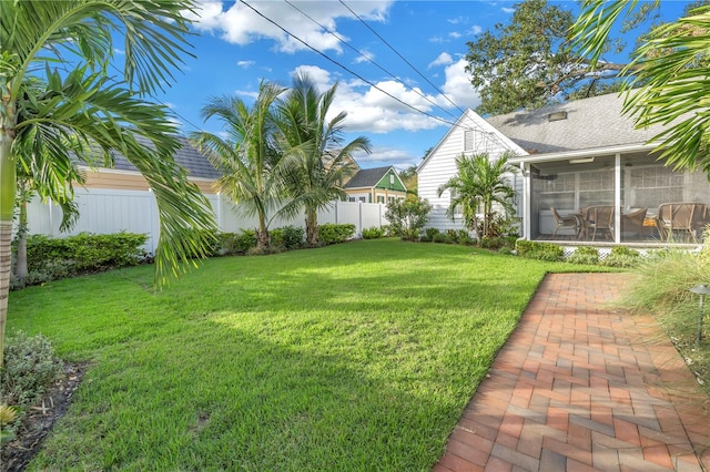 view of yard featuring a sunroom