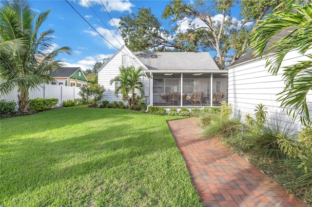 view of yard featuring a sunroom