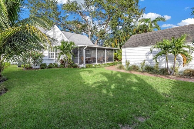 view of yard featuring a sunroom