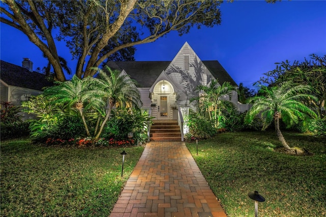 view of front of property with a front lawn