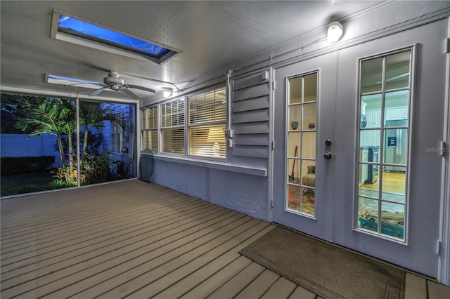 wooden terrace featuring ceiling fan