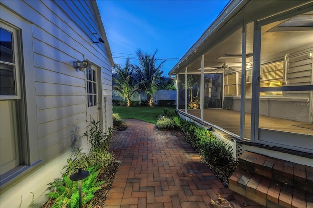 view of patio / terrace featuring a sunroom