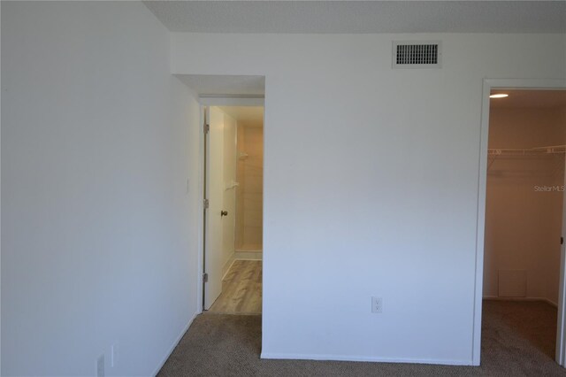 carpeted spare room with visible vents