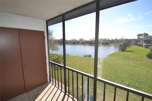 unfurnished sunroom featuring a water view and a healthy amount of sunlight