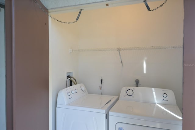 washroom featuring laundry area and independent washer and dryer