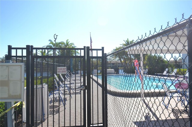 community pool featuring fence