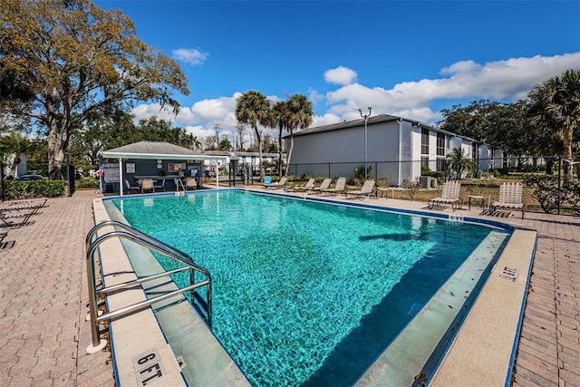 256 Cypress Ln Unit 120, Oldsmar, FL 34677 - community pool featuring a patio
