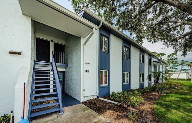 256 Cypress Ln Unit 120, Oldsmar, FL 34677 - view of exterior entry featuring stucco siding