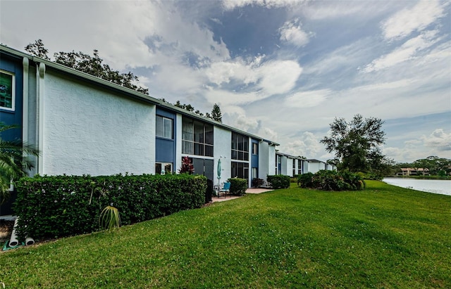256 Cypress Ln Unit 120, Oldsmar, FL 34677 - view of green lawn featuring a water view