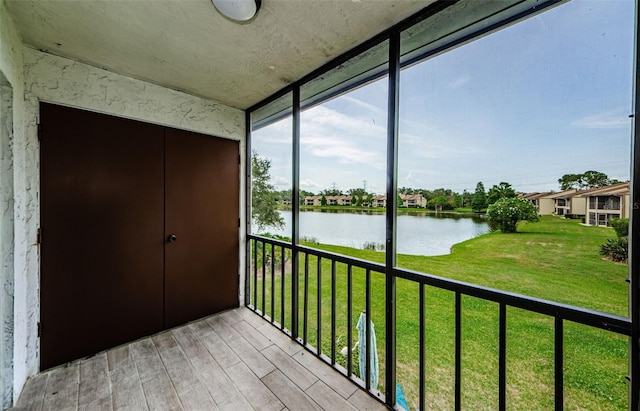 256 Cypress Ln Unit 120, Oldsmar, FL 34677 - unfurnished sunroom featuring a water view