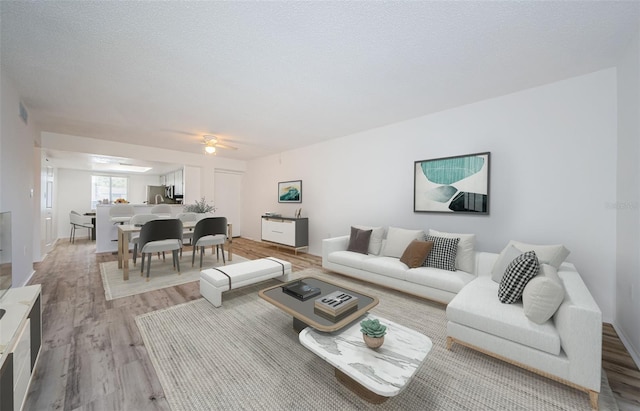 256 Cypress Ln Unit 120, Oldsmar, FL 34677 - living room with light wood-style flooring and a ceiling fan