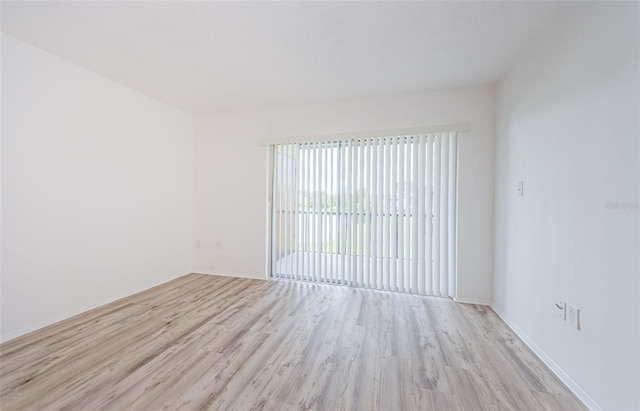 256 Cypress Ln Unit 120, Oldsmar, FL 34677 - spare room with wood finished floors and baseboards