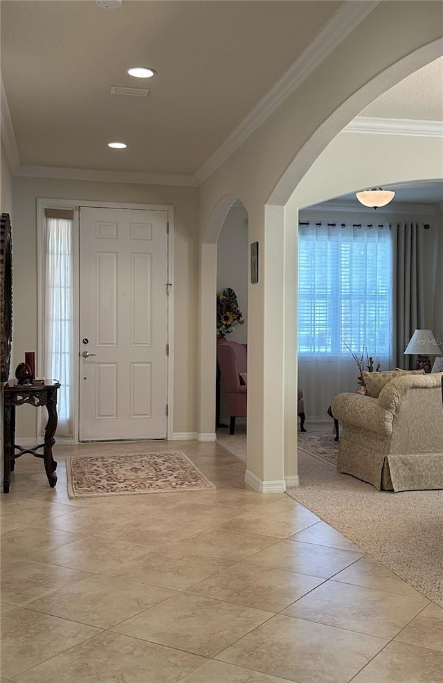 foyer entrance featuring ornamental molding