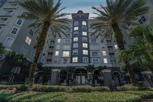 view of outdoor building at dusk