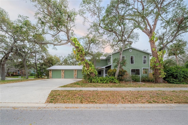 view of front of home featuring a garage and concrete driveway