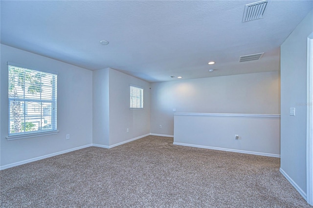 unfurnished room with carpet