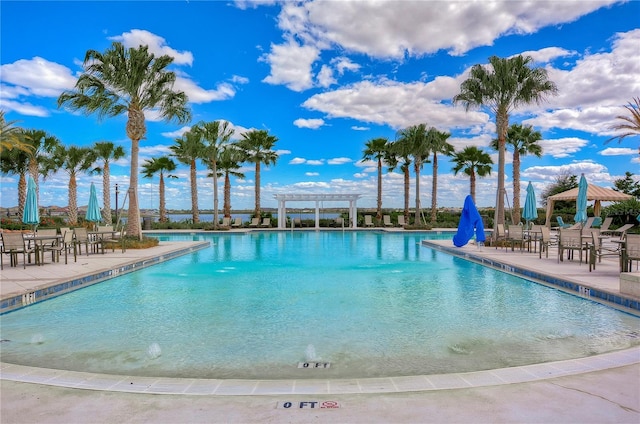 view of swimming pool featuring a pergola and a patio