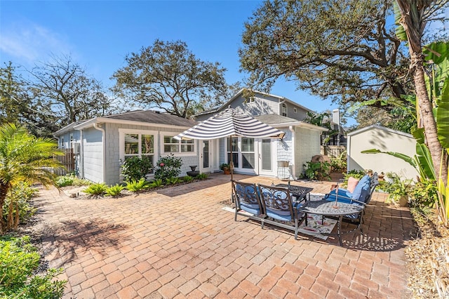 rear view of property with a patio area