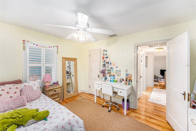 bedroom featuring ceiling fan and light hardwood / wood-style flooring