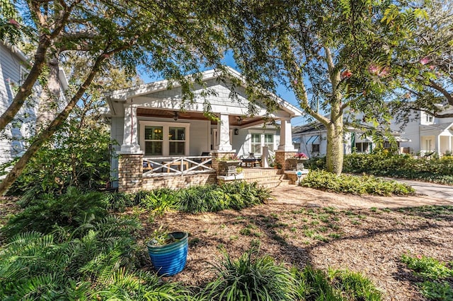 rear view of property with a porch