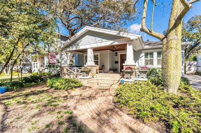 back of house featuring covered porch