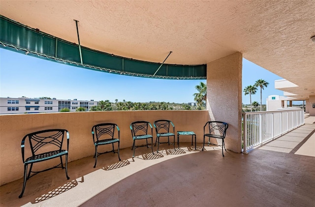 view of patio with a balcony