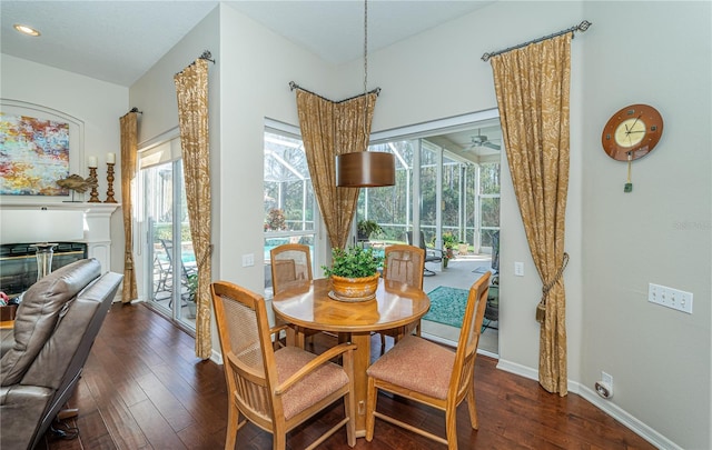 dining room with dark hardwood / wood-style floors and ceiling fan