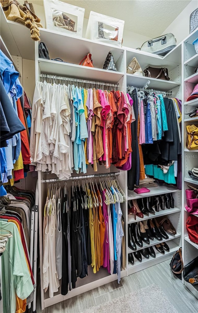 walk in closet featuring hardwood / wood-style flooring