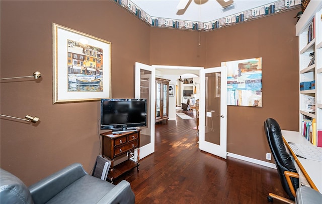 office featuring french doors, ceiling fan, and dark hardwood / wood-style flooring