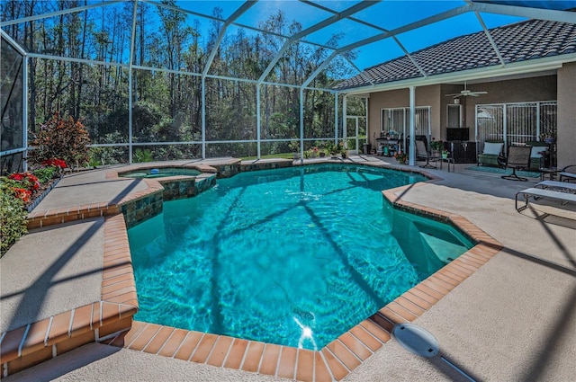 view of pool featuring an in ground hot tub, ceiling fan, a lanai, and a patio