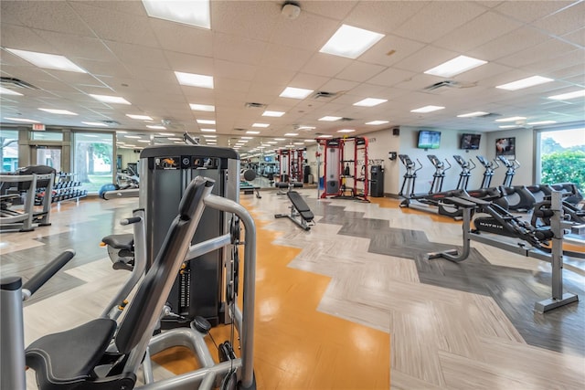 gym featuring a paneled ceiling