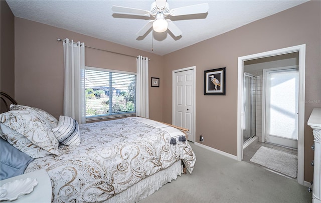 bedroom with ceiling fan, light carpet, a textured ceiling, and a closet