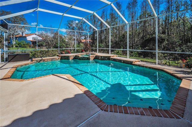 view of pool featuring an in ground hot tub, a lanai, and a patio