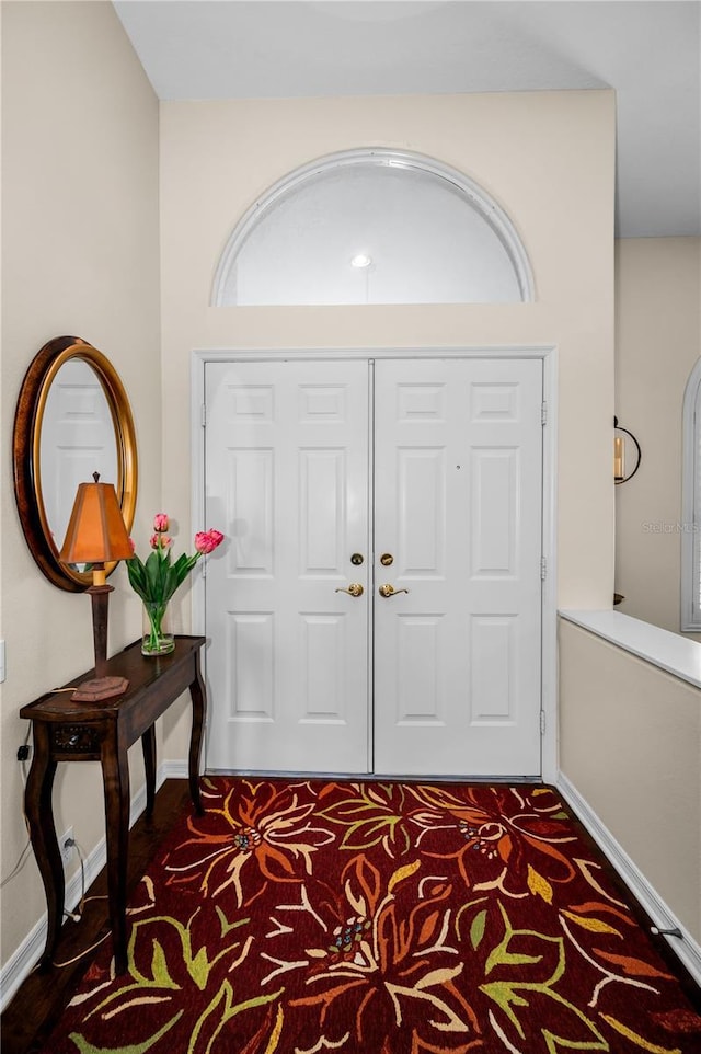 9101 Highland Ridge Way, Tampa, FL 33647 - entryway featuring baseboards and carpet