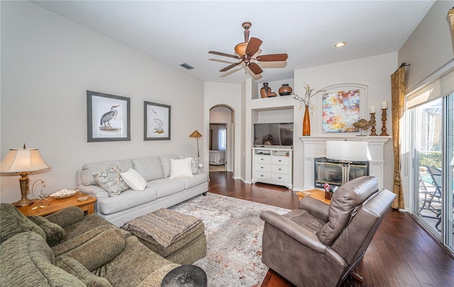 9101 Highland Ridge Way, Tampa, FL 33647 - living area with visible vents, ceiling fan, arched walkways, and dark wood finished floors
