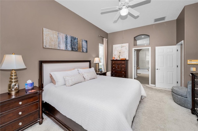 9101 Highland Ridge Way, Tampa, FL 33647 - bedroom featuring light colored carpet, ceiling fan, visible vents, and connected bathroom