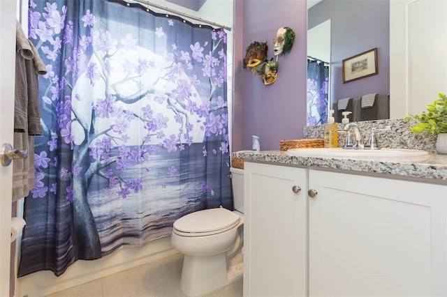 bathroom featuring tile patterned floors, toilet, and vanity