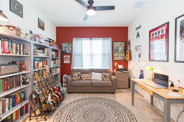 sitting room with ceiling fan and light tile patterned floors