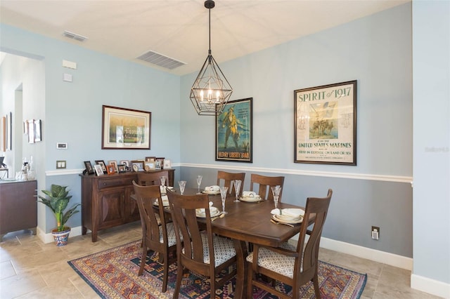 dining space with a notable chandelier