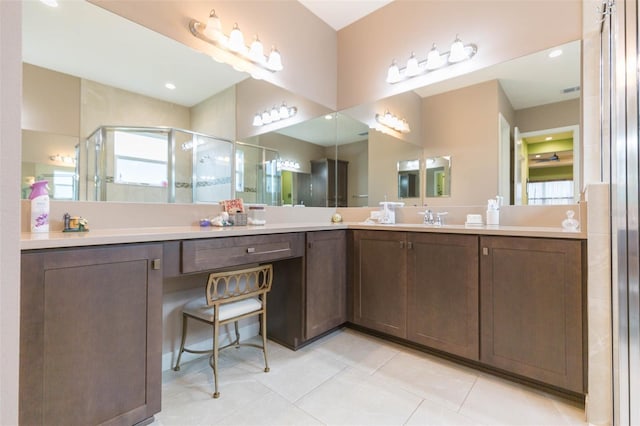 bathroom with vanity, tile patterned floors, and walk in shower