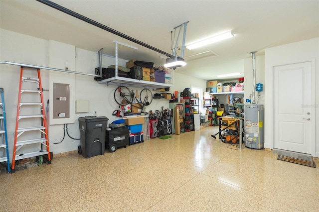 garage with a garage door opener, electric panel, a workshop area, and gas water heater