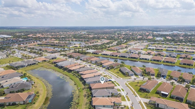 drone / aerial view with a water view