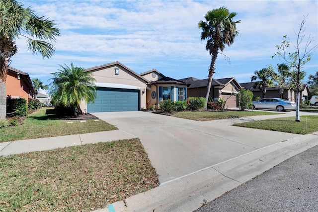 ranch-style house featuring concrete driveway, an attached garage, a front lawn, and stucco siding