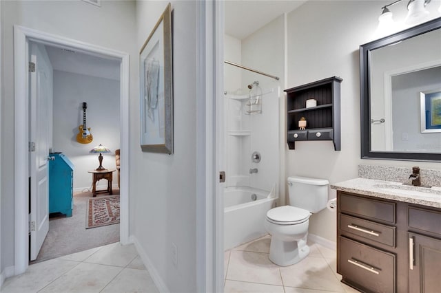 full bathroom with shower / bath combination, toilet, vanity, baseboards, and tile patterned floors